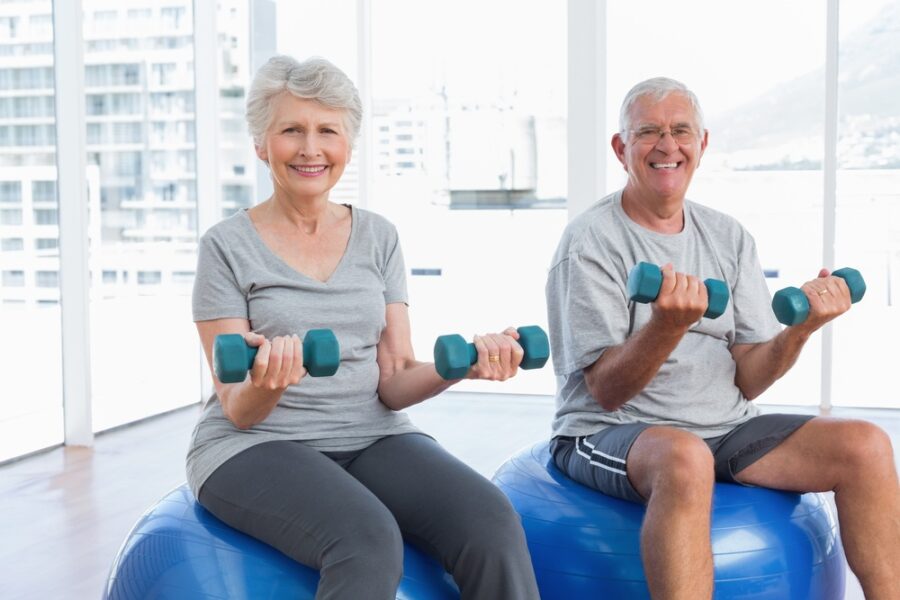 seniors-lifting-weights-exercise-ball